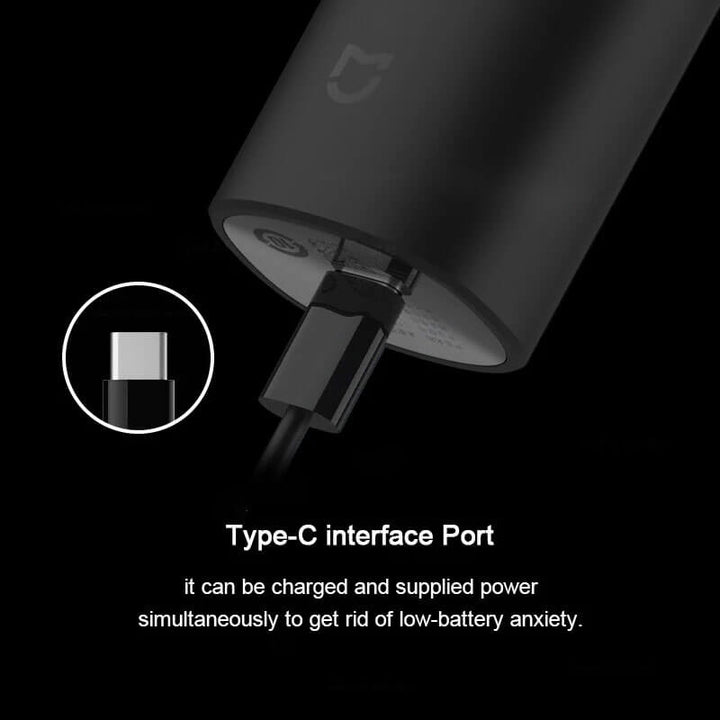 Black electronic device with Type-C interface port on a black background XIAOMI MIJIA IPX7 Hair Clippers - Professional Trimmers XIAOMI MIJIA Hair Cutting Device IPX7 Splash-Proof Hair Clippers Professional Wireless Electric Hair Trimmers for Men